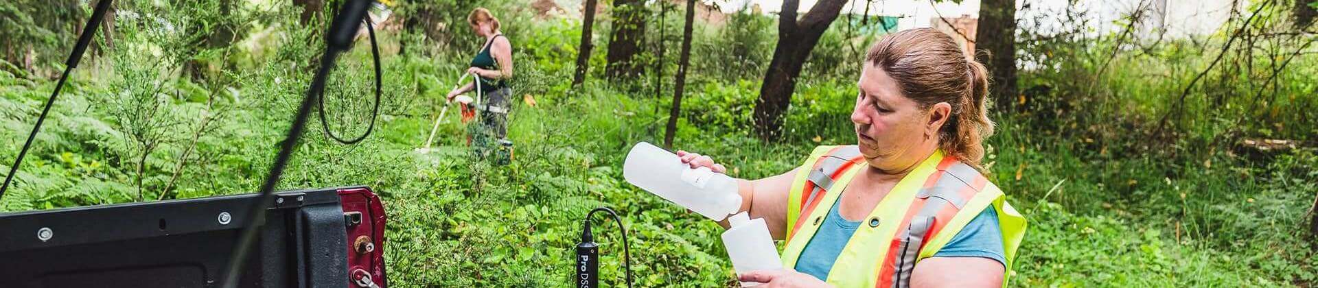 Owner Sheena Goode-Jensen standing in forest